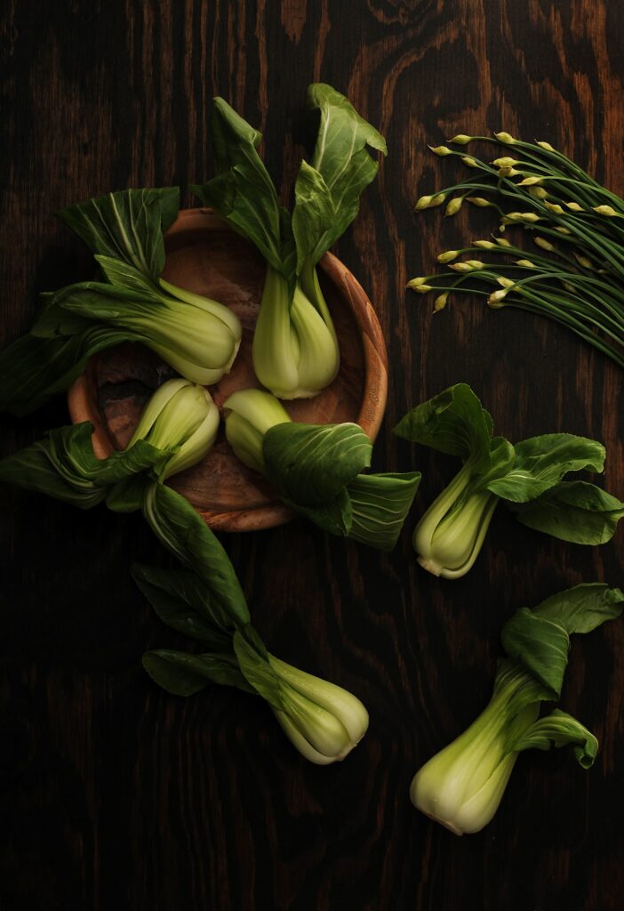 bok choy in the wooden table and plate