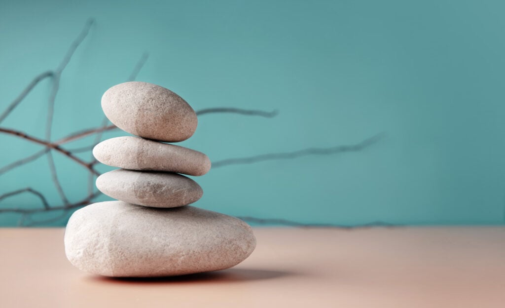 Stacked stones in perfect balance, symbolizing meditation, patience, and harmony in Zen philosophy and mindfulness practice